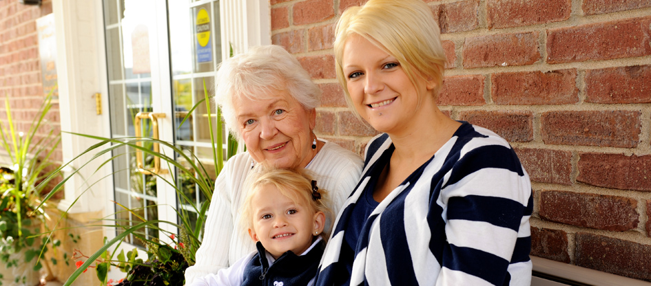 grandmother, granddaughter and great granddaughter outdoors