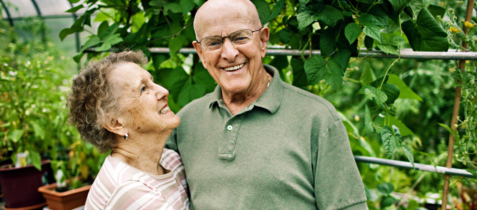 resident couple outside in garden