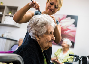 elderly woman getting a haircut
