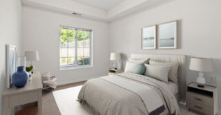 Regent at Burnsville Care Suites, resident bedroom, cozy bedding and bright window view.